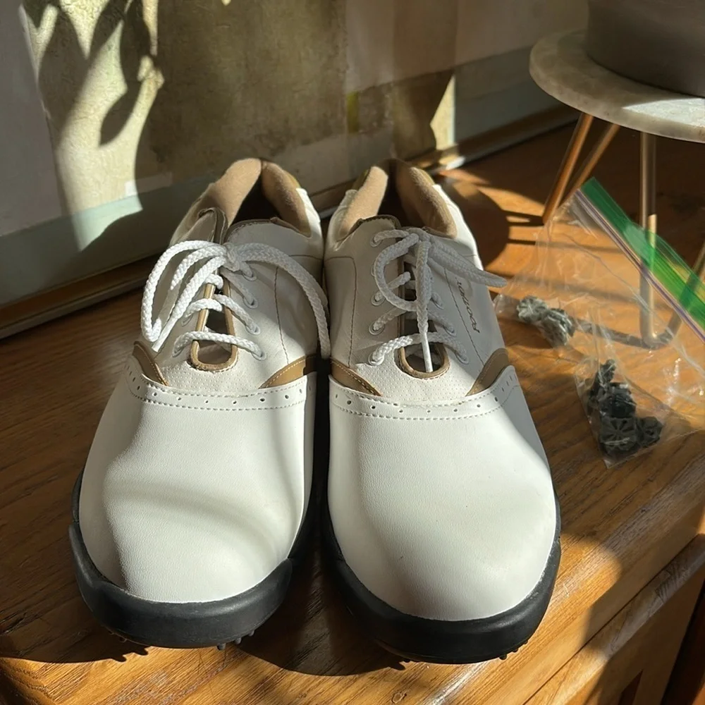 🎲 FootJoy GreenJoys 48762. Tan and white golf shoes.